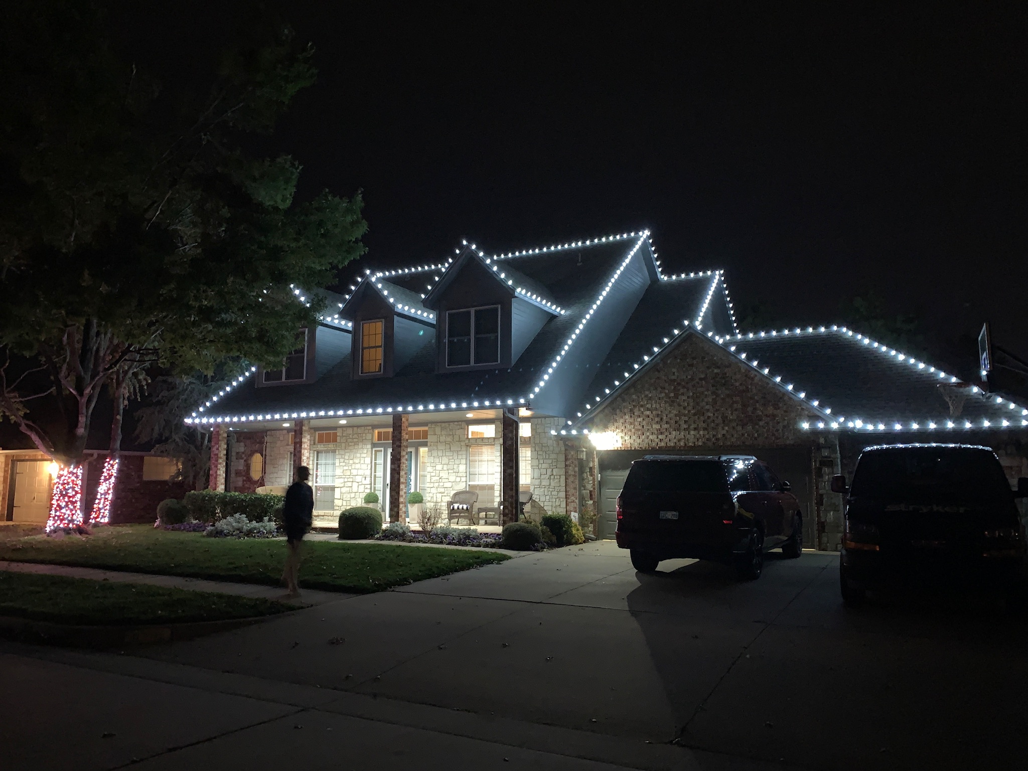 Bright white Christmas lights installed on roofline demonstrating our work in Edmond, Oklahoma