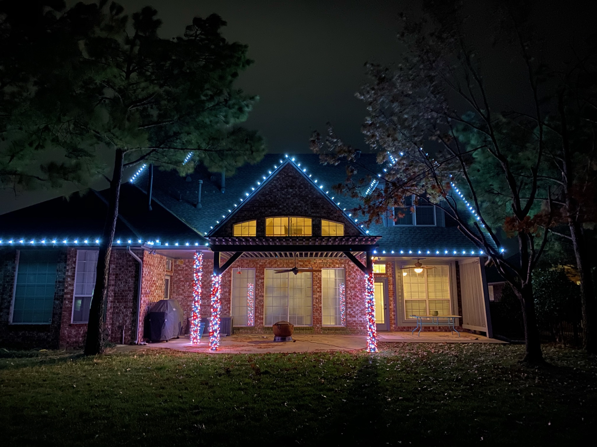 Cool blue Christmas lights installation showing our vibrant lighting services in Norman