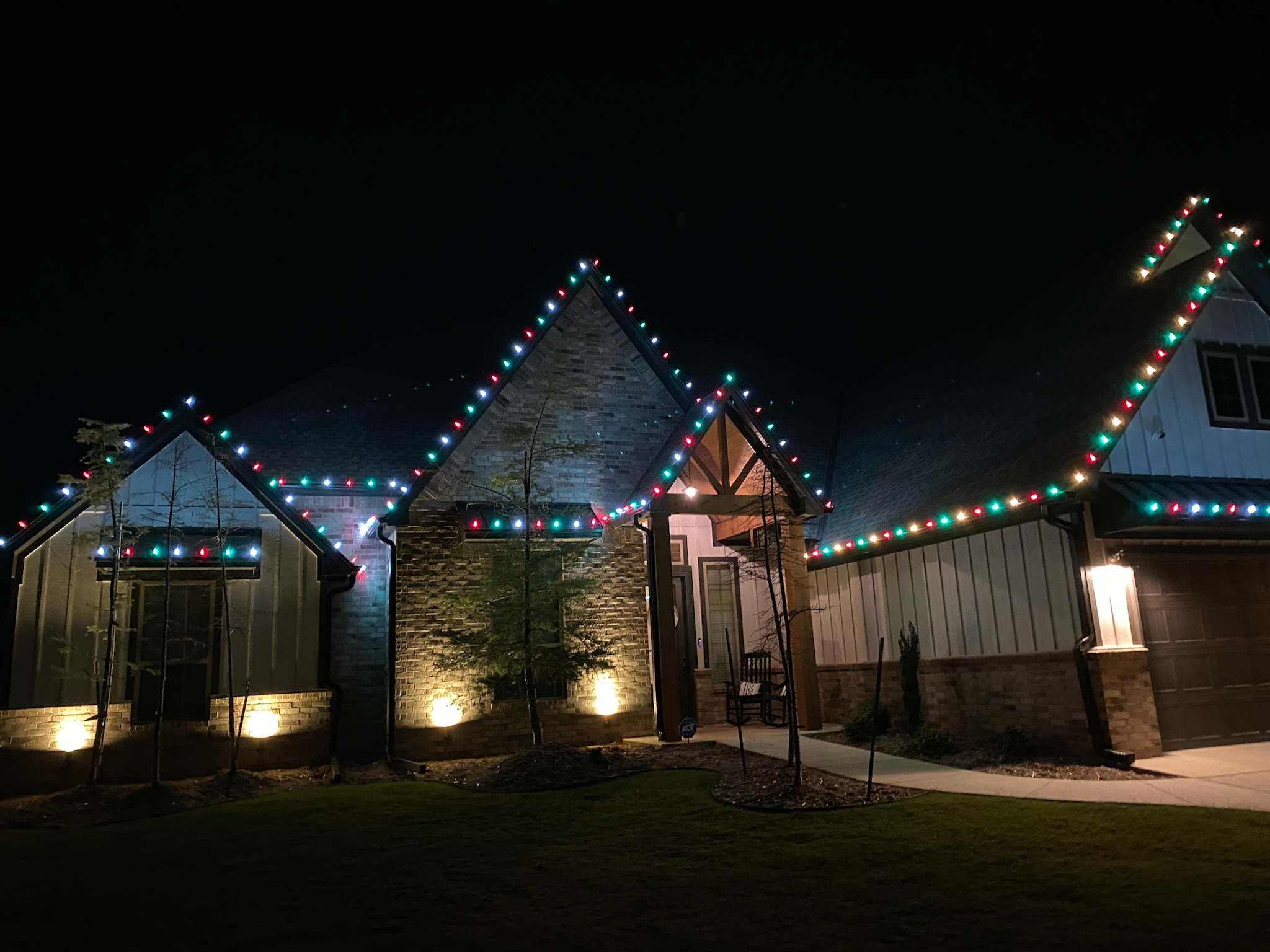 Multicolor roofline Christmas lights installation showing our vibrant lighting services in Moore