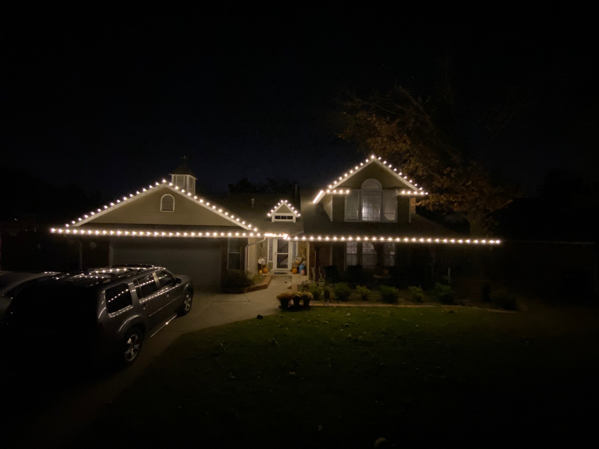 Tidy and precise roofline Christmas lights installation exemplifying our clean work in Edmond, Oklahoma